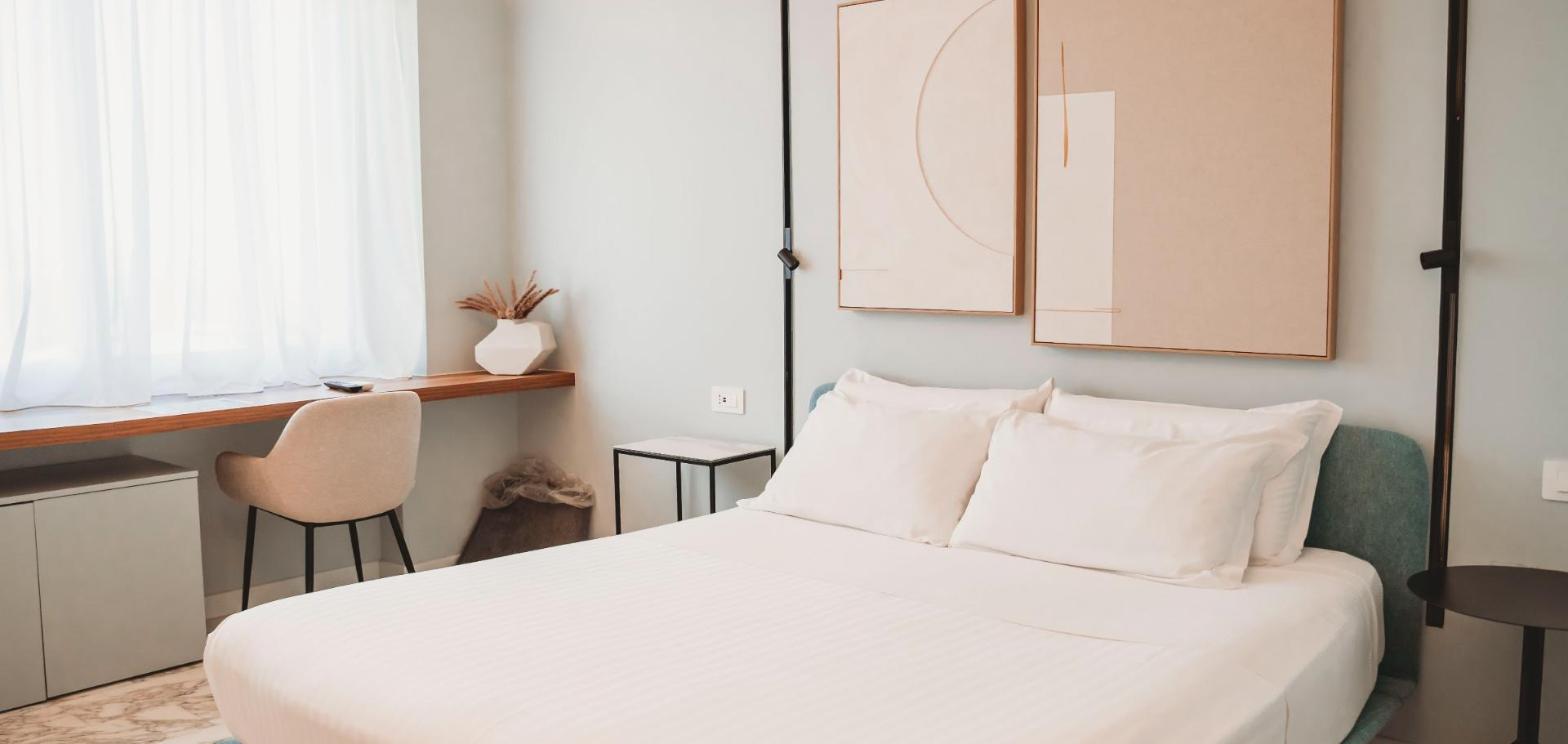 Camera matrimoniale di TPH Rooms con letto queen size